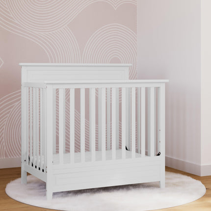 Storkcraft® Petal 4-in-1 Convertible Mini Crib with Bonus Water-Resistant Mattress
