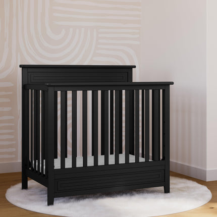 Storkcraft® Petal 4-in-1 Convertible Mini Crib with Bonus Water-Resistant Mattress