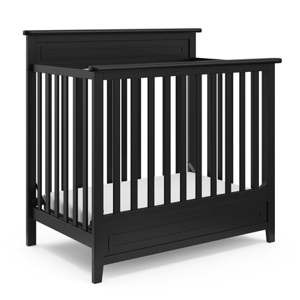 Storkcraft® Petal 4-in-1 Convertible Mini Crib with Bonus Water-Resistant Mattress