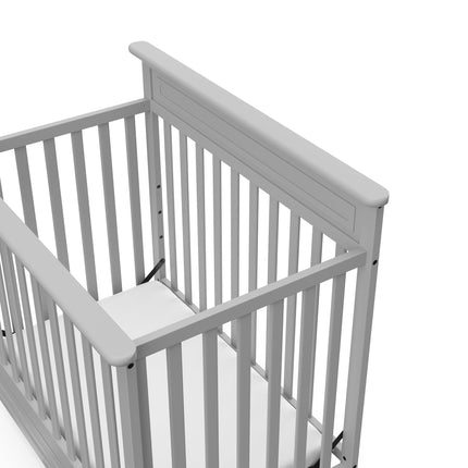 Storkcraft® Petal 4-in-1 Convertible Mini Crib with Bonus Water-Resistant Mattress