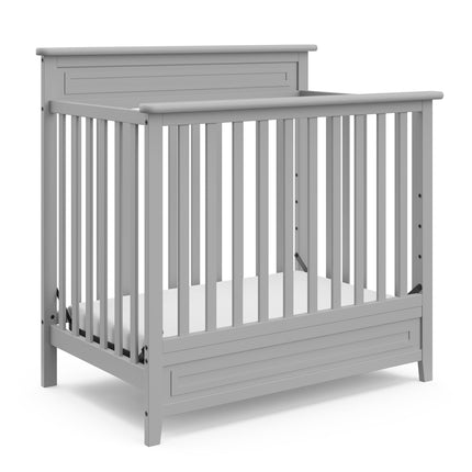 Storkcraft® Petal 4-in-1 Convertible Mini Crib with Bonus Water-Resistant Mattress