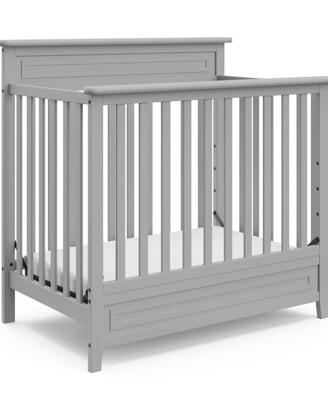 Storkcraft® Petal 4-in-1 Convertible Mini Crib with Bonus Water-Resistant Mattress