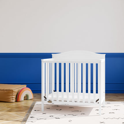 Graco® Stella 4-in-1 Convertible Mini Crib with Bonus Water-Resistant Mattress