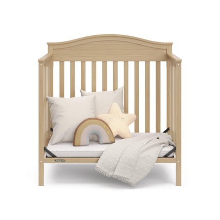 Graco® Stella 4-in-1 Convertible Mini Crib with Bonus Water-Resistant Mattress