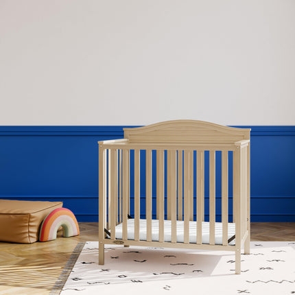 Graco® Stella 4-in-1 Convertible Mini Crib with Bonus Water-Resistant Mattress