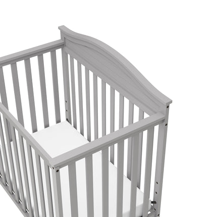 Graco® Stella 4-in-1 Convertible Mini Crib with Bonus Water-Resistant Mattress