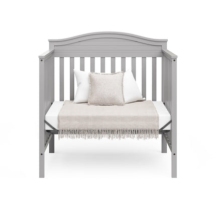 Graco® Stella 4-in-1 Convertible Mini Crib with Bonus Water-Resistant Mattress