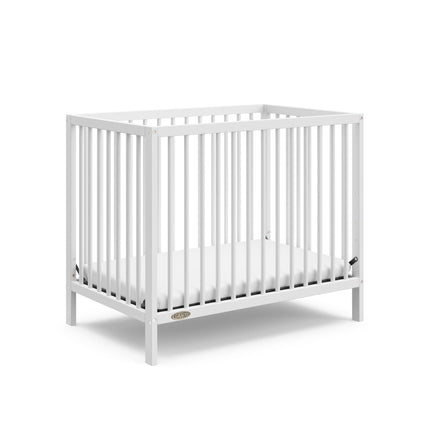 Graco® Teddi® 4-in-1 Convertible Mini Crib with Bonus Water-Resistant Mattress