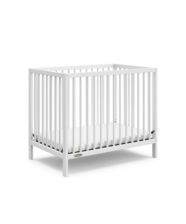 Graco® Teddi® 4-in-1 Convertible Mini Crib with Bonus Water-Resistant Mattress