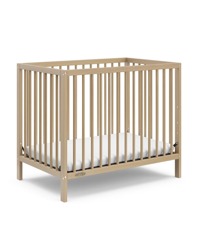 Graco® Teddi® 4-in-1 Convertible Mini Crib with Bonus Water-Resistant Mattress