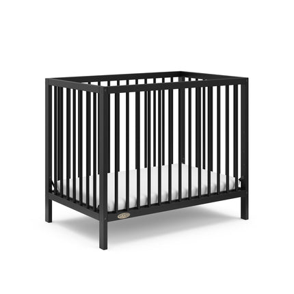 Graco® Teddi® 4-in-1 Convertible Mini Crib with Bonus Water-Resistant Mattress