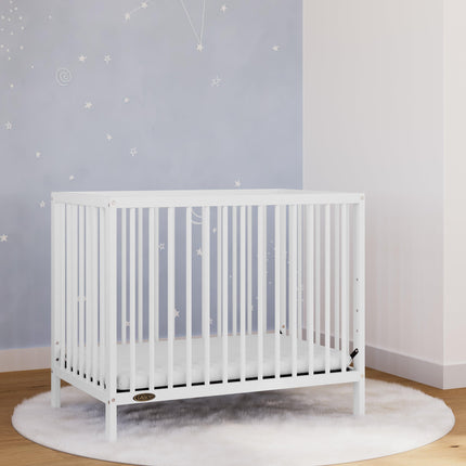 Graco® Teddi® 4-in-1 Convertible Mini Crib with Bonus Water-Resistant Mattress