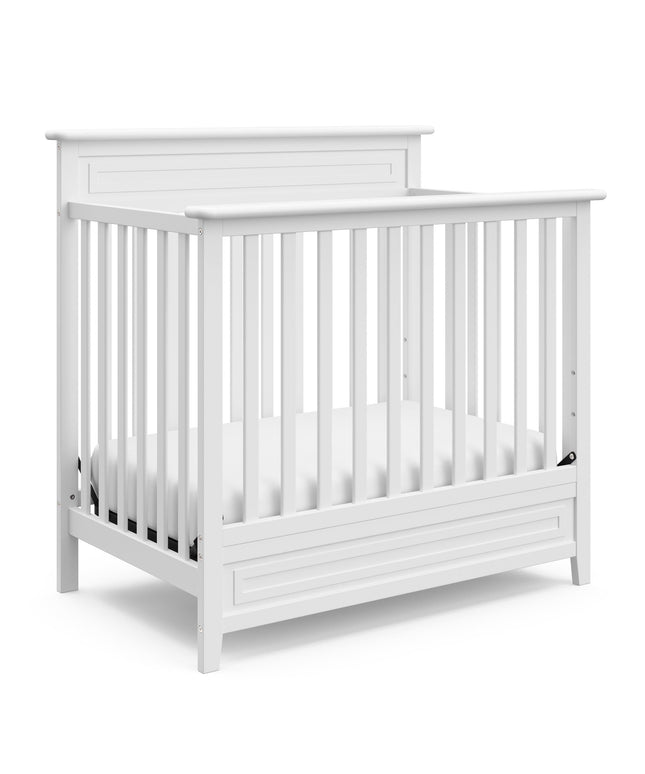 Storkcraft® Petal 4-in-1 Convertible Mini Crib with Bonus Water-Resistant Mattress